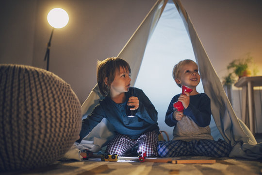 Two Boys Playing in Tent
