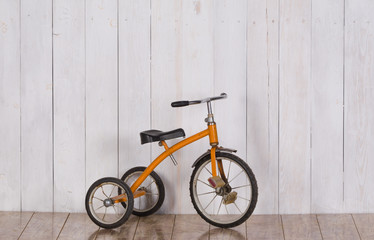 Fototapeta na wymiar Old children's bicycle