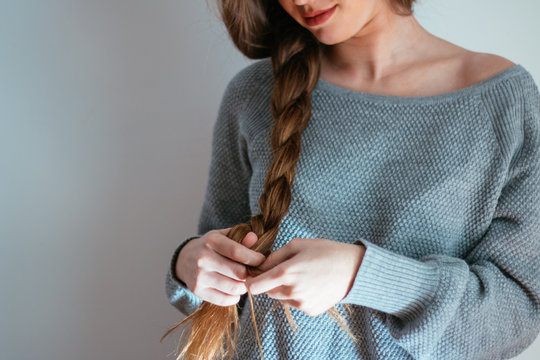 Detail of woman making a braid