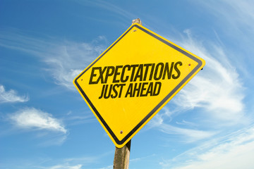Expectations Just Ahead road sign