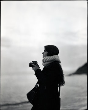Your woman taking pictures on the beach (film photo)
