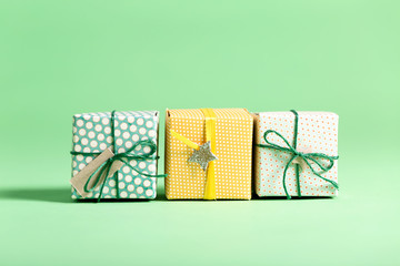 Little handmade present boxes on a bright background