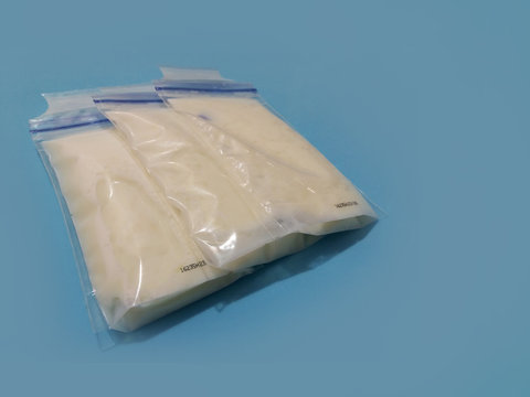 breat milk in storage bags blue backgraound