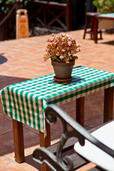 Fototapeta na wymiar street cafe table with Checkered tablecloth