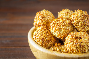 cookies with sesame seeds on a wooden table