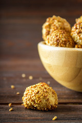cookies with sesame seeds on a wooden table