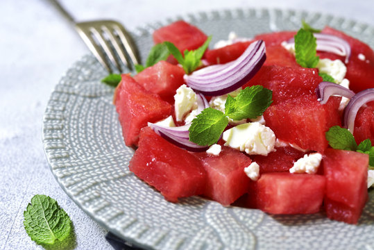 Watermelon salad with feta and red onion.
