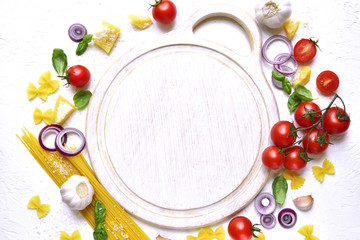Traditional raw ingredients of mediterranean cuisine and epmty cutting board.Top view with space for text.