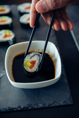 Sushi Being Dipped