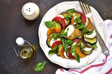 Traditional italian salad caprese with eggplants.Top view.