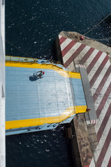 Biker on the ferry ramp, view from the upper deck