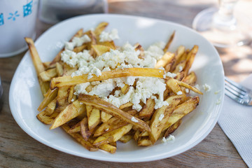 fried potatoes with white cheese