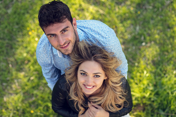 Obraz premium High angle view of happy couple standing on grass
