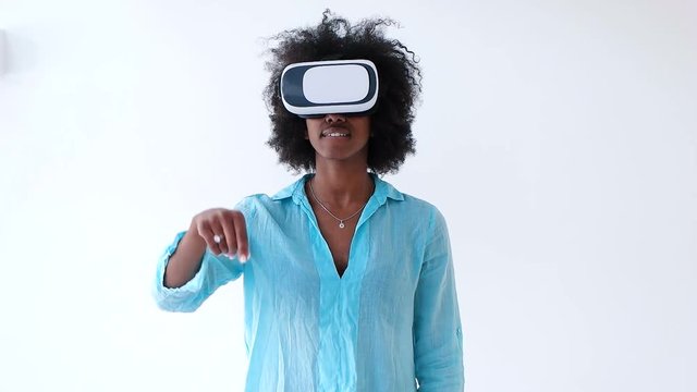 Woman toching virtual objects in vr glasses