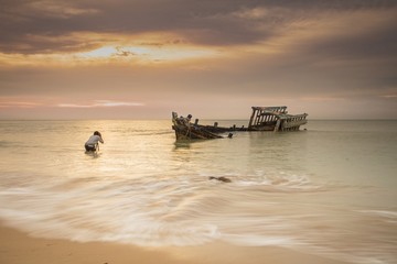 Photographer and shipwreck.