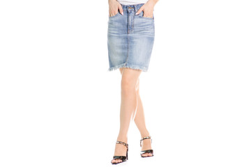 Naklejka premium Legs in shoes young girl denim skirt