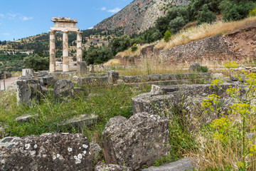 Fototapeta na wymiar Amazing view of Ruins and Athena Pronaia Sanctuary at Ancient Greek archaeological site of Delphi, Central Greece