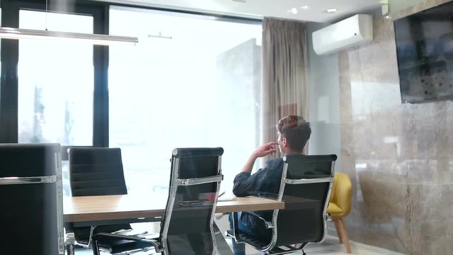 businessman relaxing in meeting room after compleated work