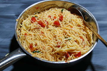 Tomato and basil angel hair pasta topped with parmesan cheese