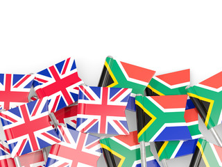 Flag pins of United Kingdom and South Africa isolated on white