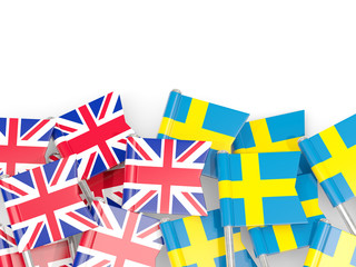 Flag pins of United Kingdom and Sweden isolated on white
