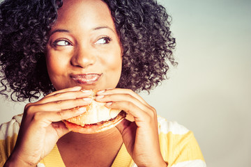 Woman Eating Hamburger