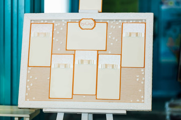 Wedding seating chart on the easel in the park. - 168818650