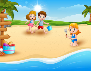 Obraz na płótnie Canvas Children playing at the beach