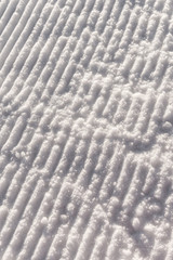background of groomed snow