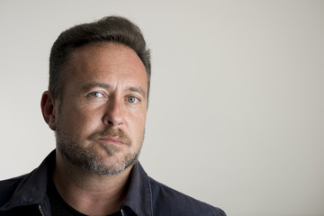 Portrait of an Adult Man Over Gray Background Copy Space