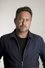 Portrait of Adult Male in Navy Blue Jacket Over Gray Background