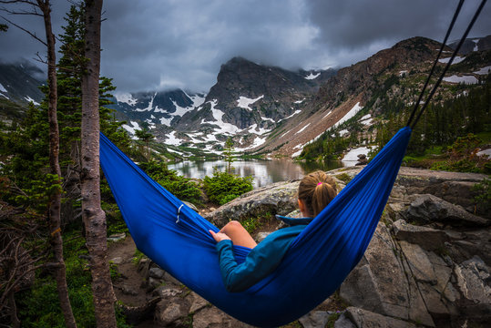 Woman relaxes on a hammock lake Isabelle Colorado