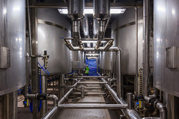 Stainless steel mixing tank on production line in pharmacy and beverage industry manufacture factory