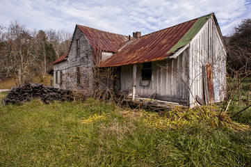 Obraz premium White Walls and Rusted Tin Roof - Abandoned Farm House