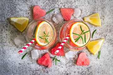 Watermelon lemon lemonade with pieces of watermelon in shape of heart. Refreshing summer drink concept
