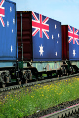 Train Freight transportation. Cargo transit. Summer Day. Container textured by flag of the Australia