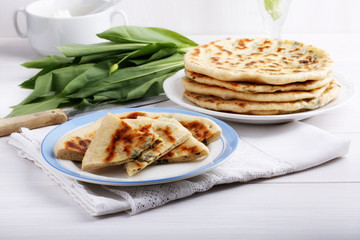 Khychiny – traditional caucasian flatbread filled with сheese and herbs.