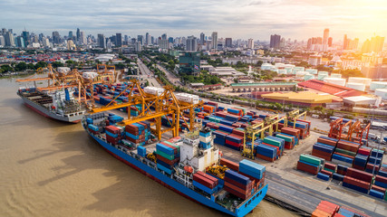 Container ship in import export and business logistics, By crane, Trade Port, Shipping cargo to harbor, Aerial view from drone, International transportation, Business logistics concept