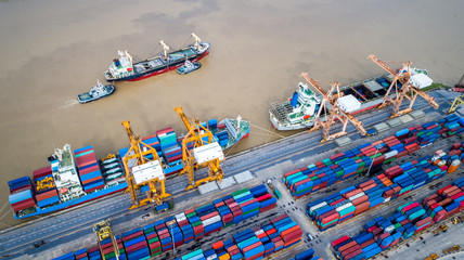 Container ship in import export and business logistic,By crane,Trade Port, Shipping cargo to harbor, Aerial view from drone, International transportation, Business logistics concept