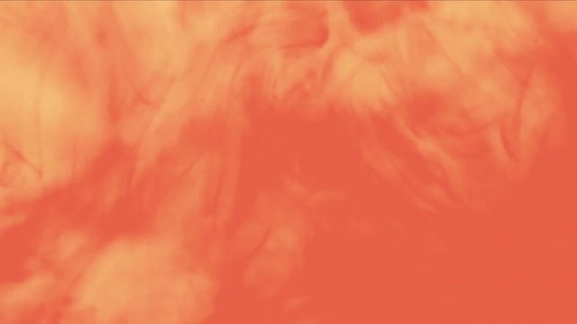 Yellow liquid color poured into water. A filmed video of Colors flowing under water forming organic abstract underwater sculptures. Dynamic background. Color falling rapidly.