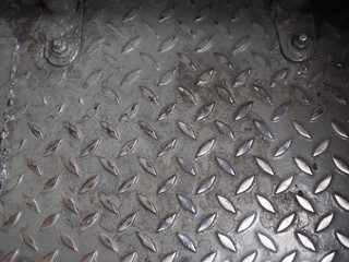 Old dirty grey steel checker plate pattern, embossed texture, background