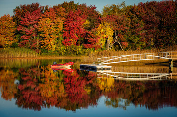 Dinghy on lake with fall foliage near Kennebunkport, Maine