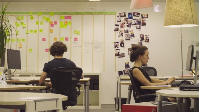 Cheerful office. Man and woman throws papers