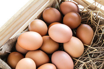 Eggs in wooden box.