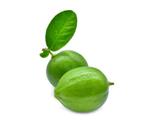 two whole of fresh green lime with green leaf isolated on white background