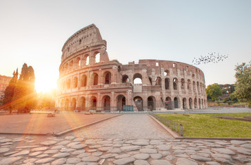 Fototapeta na wymiar Colosseum at sunrise, Rome. Rome best known architecture and landmark