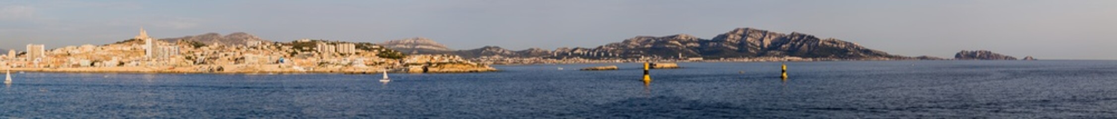 Fototapeta na wymiar The city of Marseille seen from the boat leaving the port