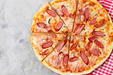 Traditional Italian  pizza with Sausage and Cheese on stone table, Top view, copy space