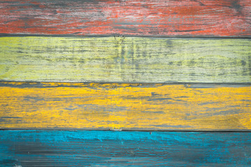 Colorful painted wood plank background.
