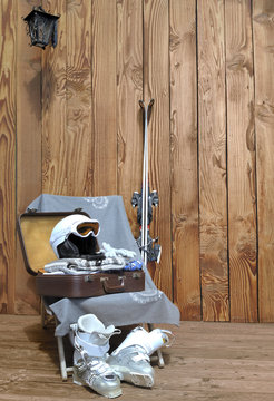 valise  et &eacute;quipement pour le ski sur  terrasse bois 